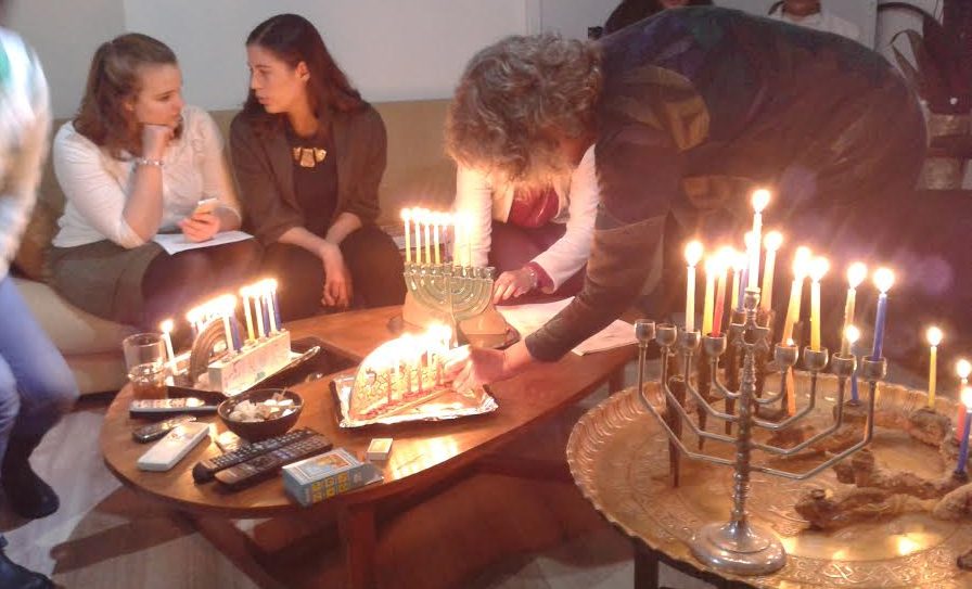 Sion celebrate Hanukkah with Jewish family.
